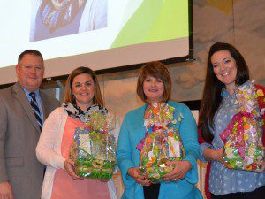 At the 2014 Teacher Induction Ceremony held Friday, March 7, BCSD’s superintendent Dr. Rodney Thompson poses with the 2014 top three Teacher of the Year Honor Roll honorees-- Heather Ducker of Goose Creek High, Carolyn Mullinax of Boulder Bluff Elementary, and Lauren Reeder of Marrington Elementary.NE
