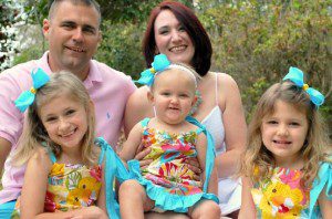 Pictured: Matt Smoak with his wife and three young daughters.