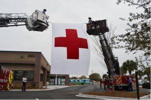 The Red Cross flag flew high from fire truck ladders at the grand opening of the new Red Cross Headquarters for the Lowcountry.