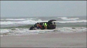 Courtesy: WESH-TV Pictured: Rescuers run to save the mother's three children left in the van.