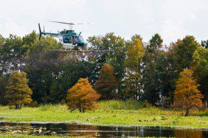 Santee Cooper file photo of helicopter treatments of EPA-approved aquatic herbicides for invasive weeks (2012). Photo credit: Jim Huff