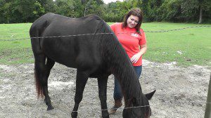 Pictured: Tracey Sawyer with one of her rescue horses