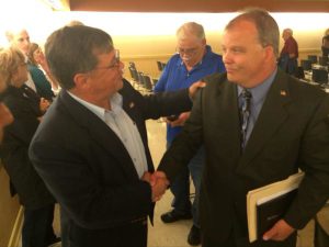 Candidate Jerry Merrithew congratulates Brian Adams after the vote. (Courtesy: Raymond Owens/Via Twitter)