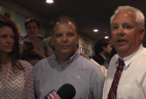 Brian Adams joins Lewis to congratulate him on his win in the runoff.