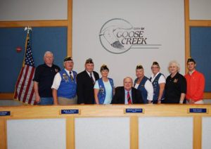 Goose Creek Mayor Michael Heitzler is joined by (l-r) John Tharp, FRA Convention Chairman Chuck Hines, Southeast Regional FRA President Larry Cox, FRA Branch 269 President Laurie Bailey, FRA Auxiliary Convention Co-Chair Mary Lopez, FRA Branch 269 Auxiliary President Theresa Milligan, Marilyn Tharp and Tyler Malmgren.