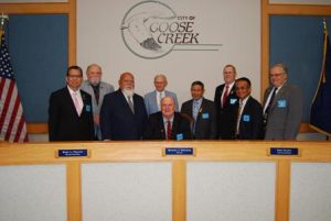 Goose Creek Mayor Michael Heitzler signs the Knights of Columbus Family Week proclamation on Monday, Aug. 3 at City Hall. Mayor Heitzler is joined by (l-r) Frank Bautista Jr., Donald Bailey, Nazario Yangco, John Camp, Remi Silva, Grand Knight Steve Gearhart, Francisco DeAsis, and Past Grand Knight John Flinn.