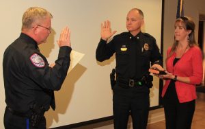 Goose Creek Police Chief Harvey Becker promotes John Grainger to the rank of Major at the Jan. 4 swearing-in ceremony, as Grainger’s wife, Lisa, holds the Bible.
