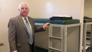 Pictured: Sheriff Duane Lewis inside the new floor of the jail.