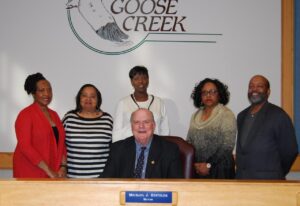 Goose Creek Mayor Michael Heitzler is joined by (l-r) Goose Creek NAACP First Vice President Brenda Bines-Watson, Health Committee Member Christine Walker, President Veronica Dukes, Secretary Linda Miller, and Treasurer Kenneth Harris at Monday’s ceremony.