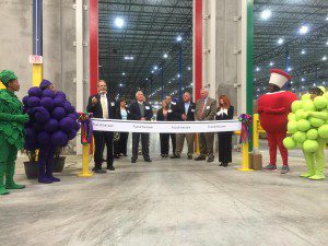 Berkeley County officials joined Fruit of the Loom leaders for the ribbon cutting, which was really elastic similar to that used in Fruit of the Loom under garments.