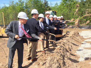 Local and state officials joined the developers for the Charleston Trade Center groundbreaking.