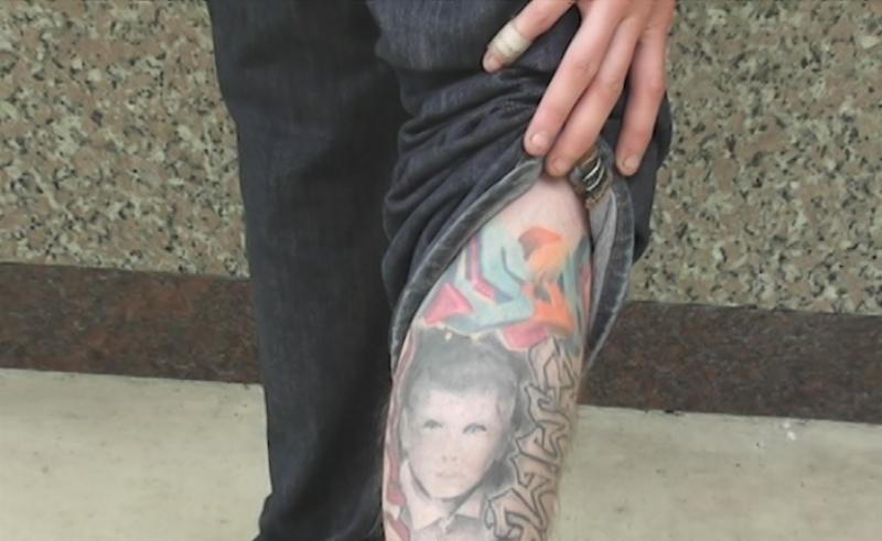 Pictured: Justin Smith shows off a tattoo that he got in memory of his best friend, Justin Turner. 