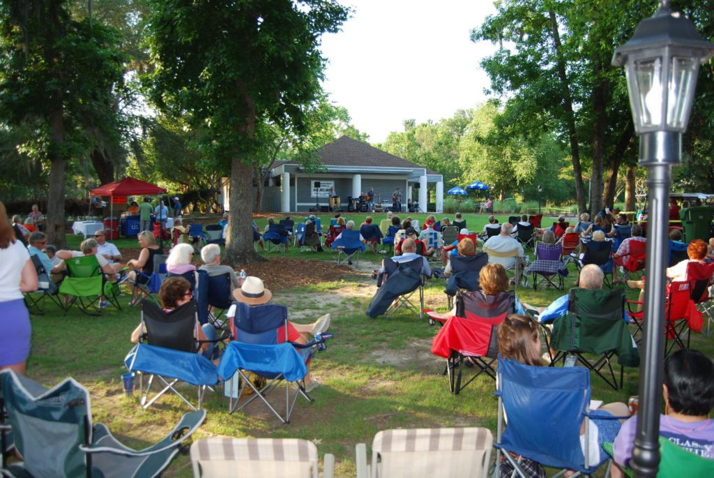 Pictured: Residents enjoy listening to a band during the 'Sounds of Summer' concert series