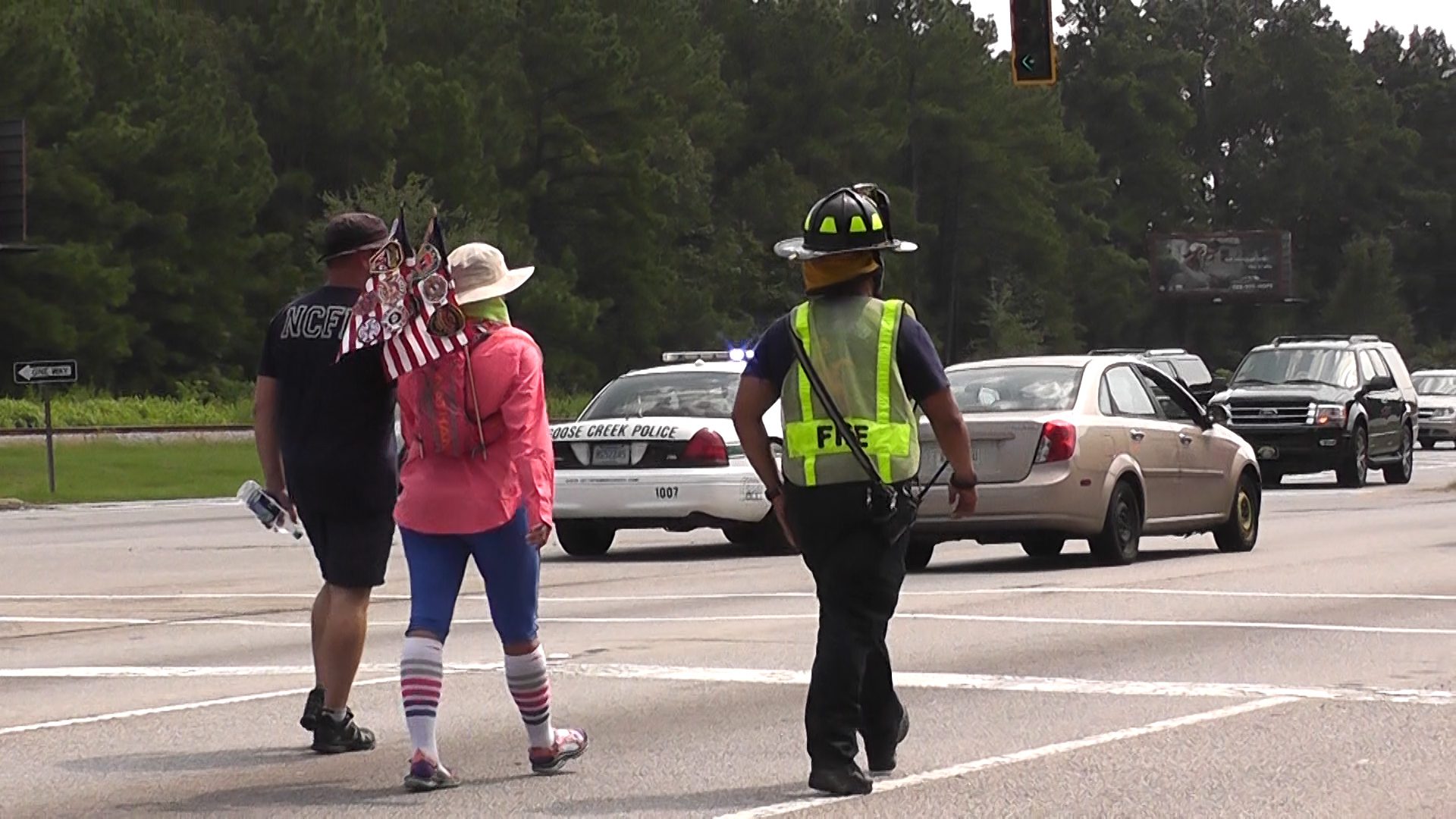 Pictured: Anna proudly carries her American flag on her backpack. 