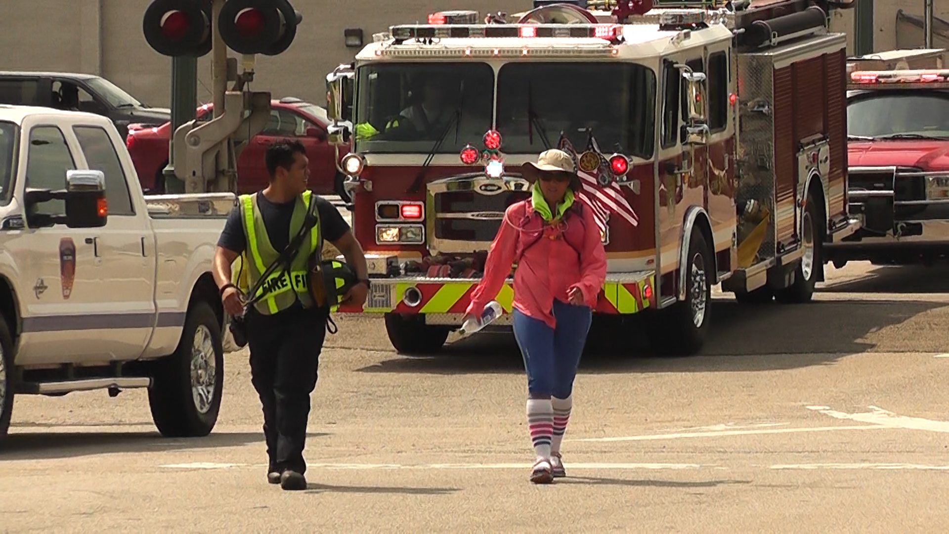 Pictured: Anna DeWitt walks through Goose Creek with various fire departments following her every step.