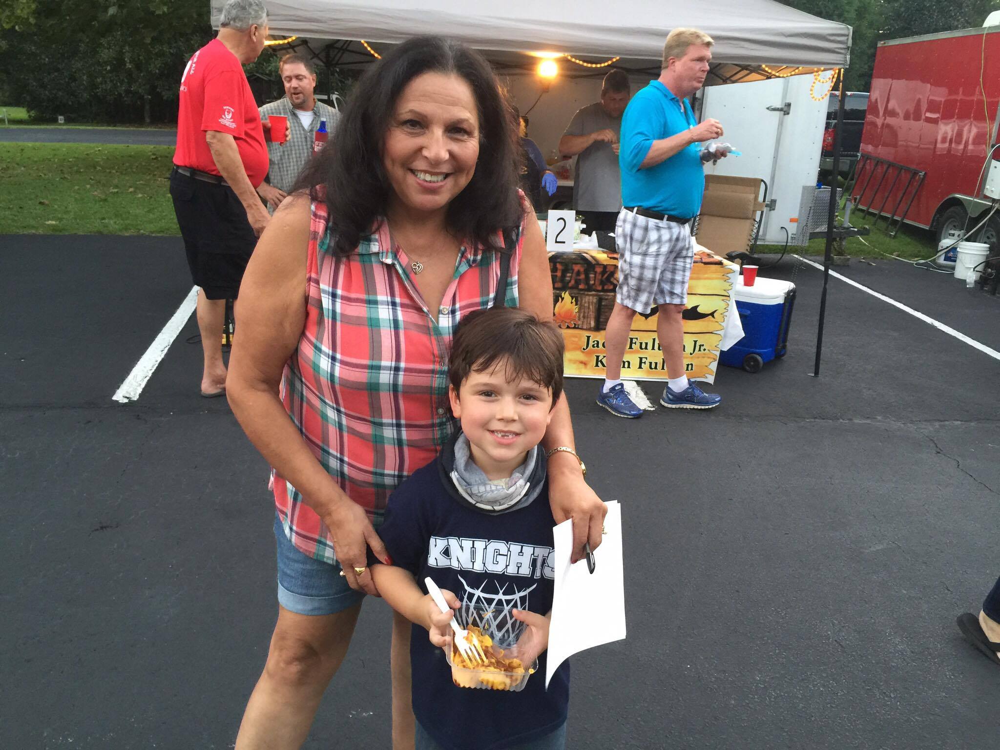 Roberta Bunch and Caleb Merritt, 6, of Summerville enjoying the cook off.