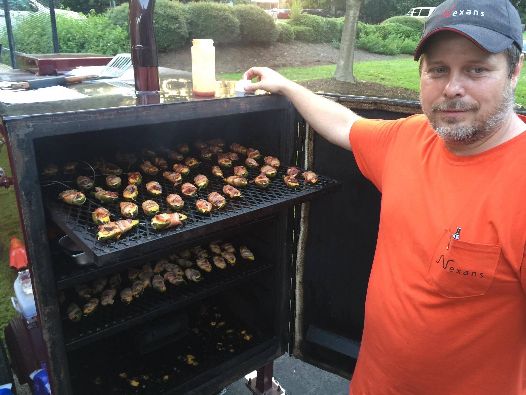 Dennis Jarrett of Pot Belly Cookers of Summerville shows off his "Brisket Grenades" for the "Anything But BBQ" competition.