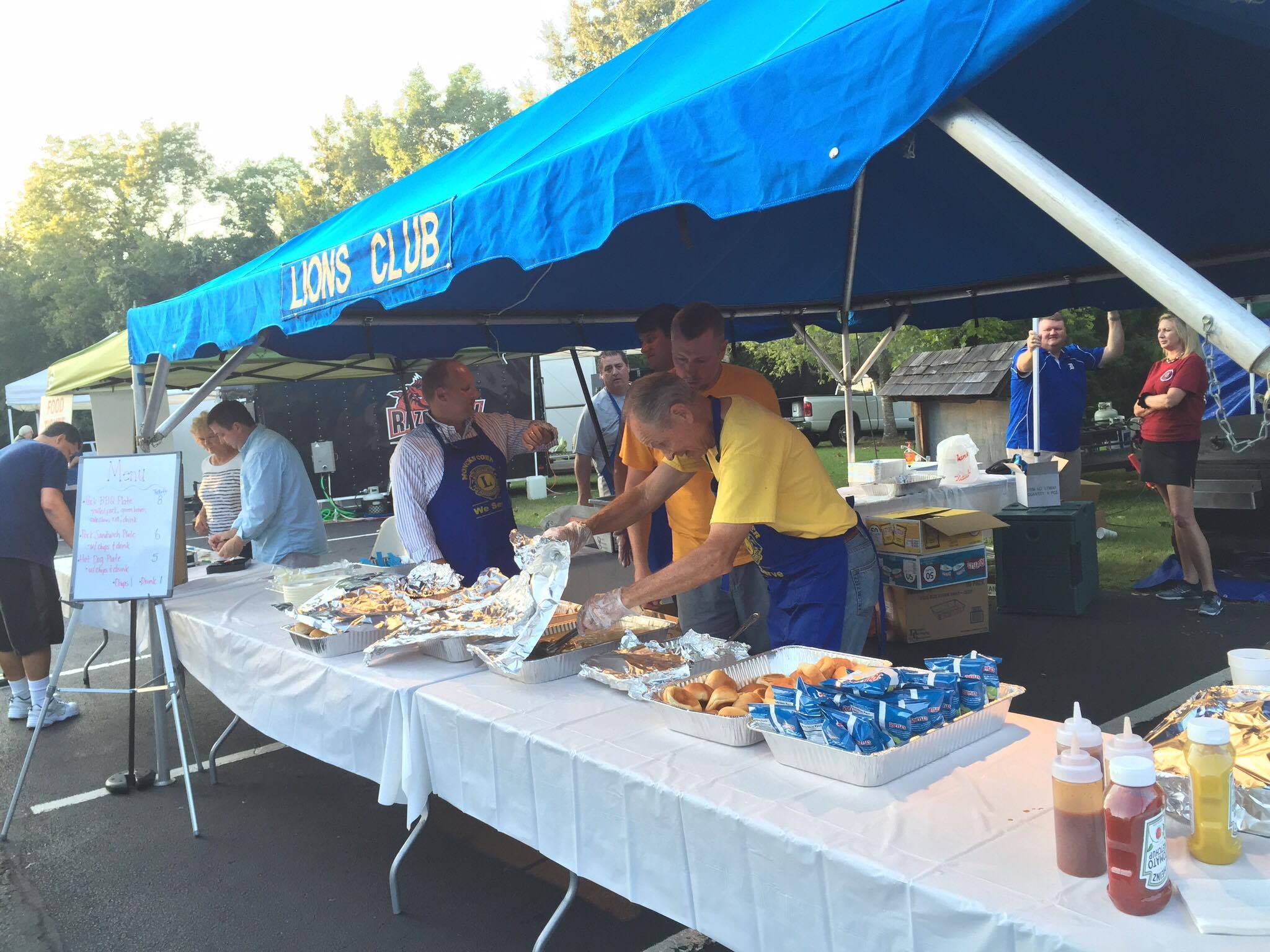 David Rehr, of Pinopolis, and a Lions Club member, fills plates at the event. 