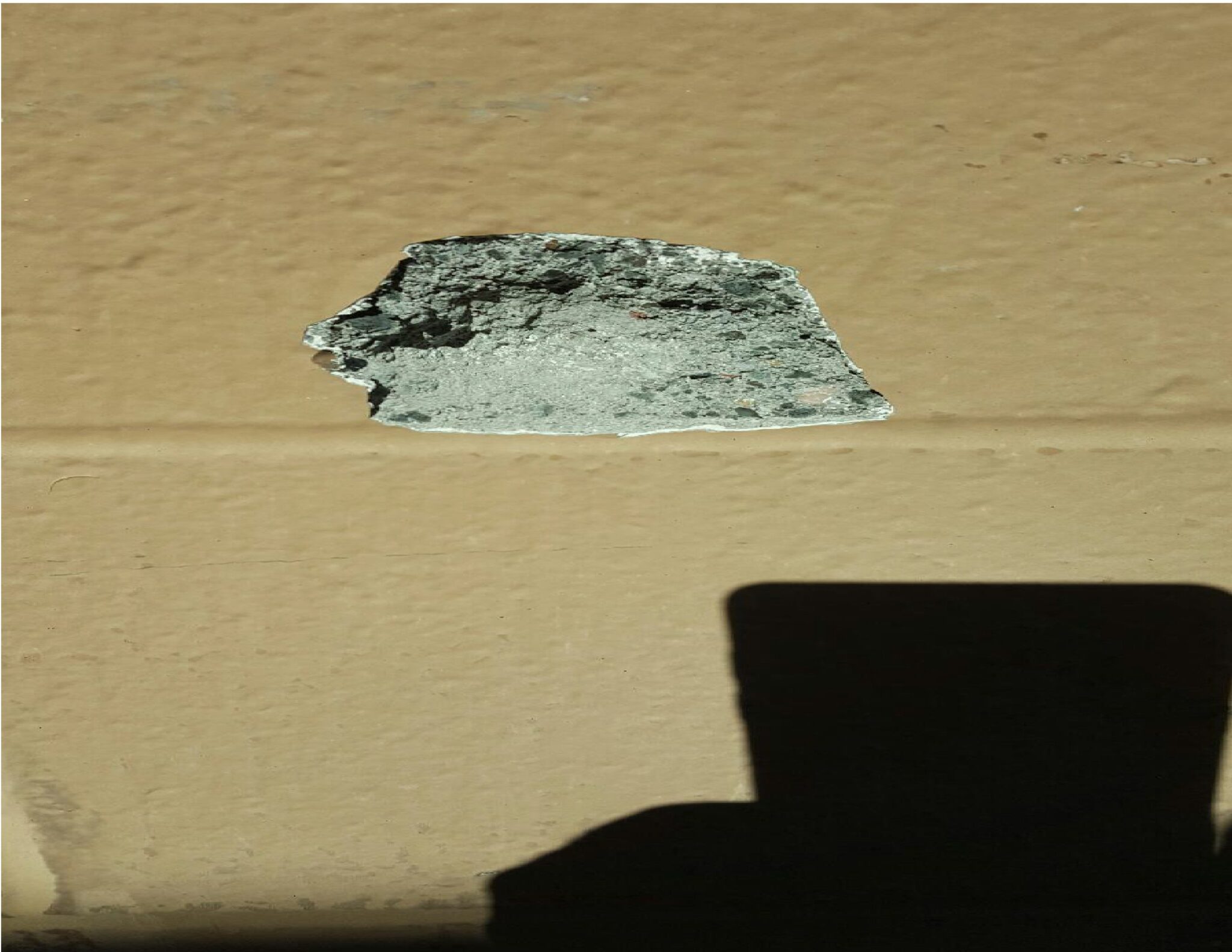 Pictured: A bullet also hit Walmart's building next to an emergency door exit.